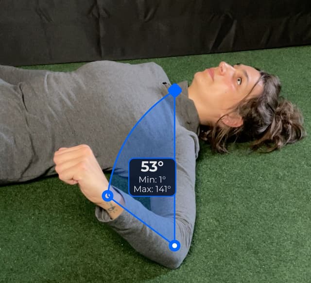 Side view of patient, supine, demonstrating the external rotation/internal rotation movement. Visual overlay shows a 53 degree angle measurement.