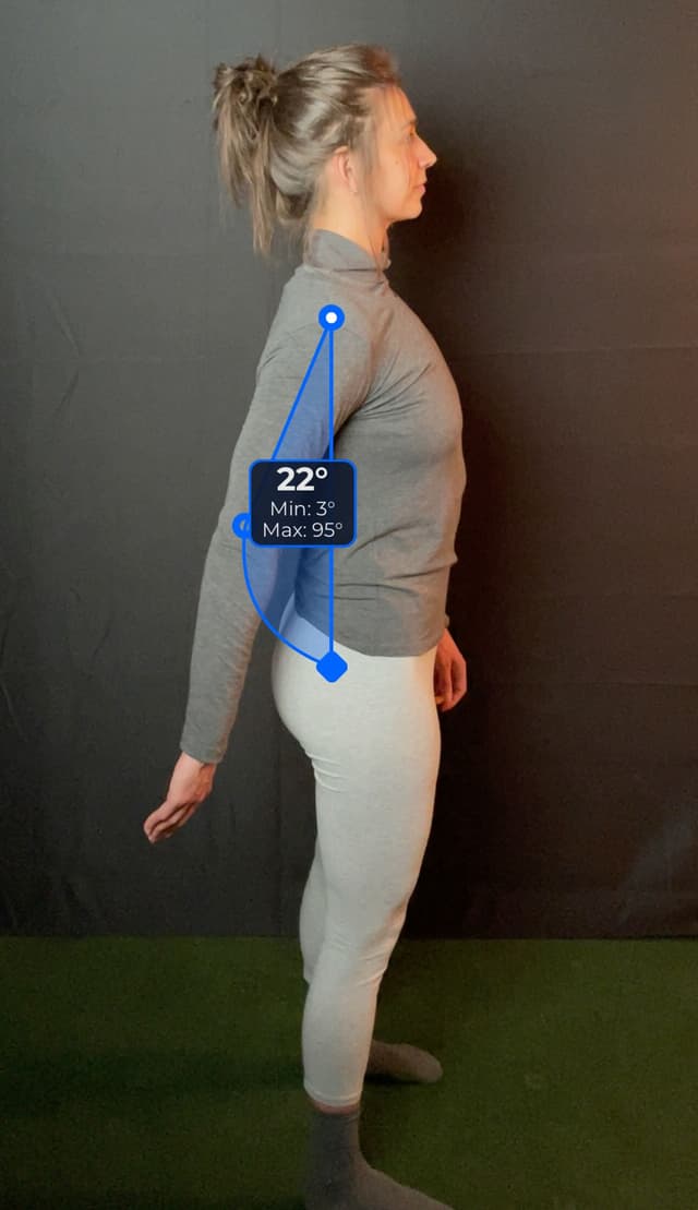 Side view of patient demonstrating the flexion/extension movement, arm extended to the back. Visual overlay shows a 22 degree angle measurement.